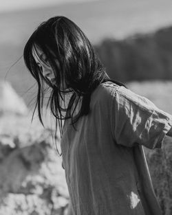 Close-up of woman standing on field