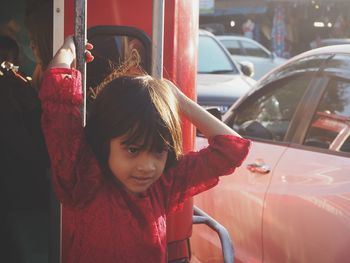 Portrait of girl in car