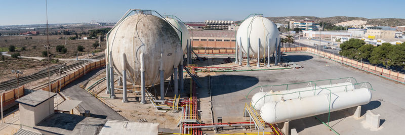 High angle view of construction site by buildings against sky