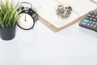 High angle view of clock on table