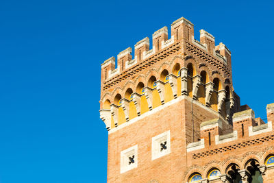 Low angle view of building against blue sky