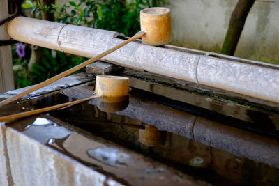 Wooden ladles on japanese drinking fountain