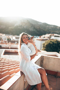 Young woman sitting on steps