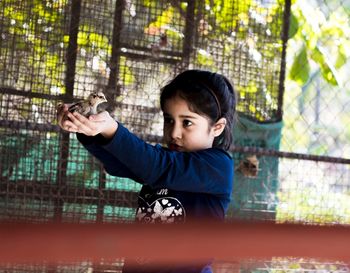 Portrait of boy playing in park