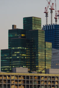 Modern buildings in city against sky