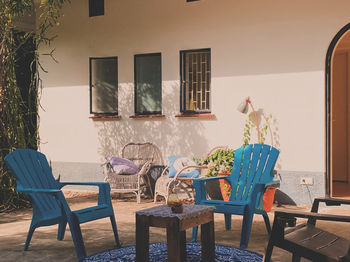 Empty chairs and tables and table and chair and lounge and plates on floor at home