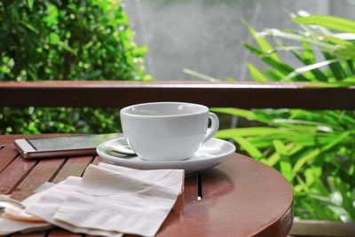 Close-up of coffee cup on table