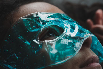 Close-up portrait of girl wearing eye therapy mask 