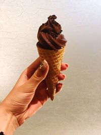 Hand holding ice cream cone