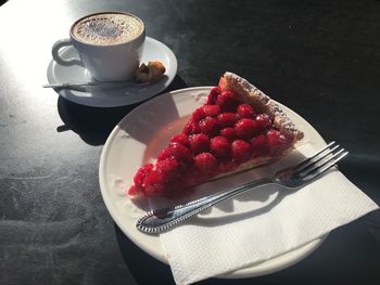 High angle view of coffee and cake on table