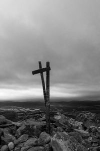 Scenic view of rocks on field against sky