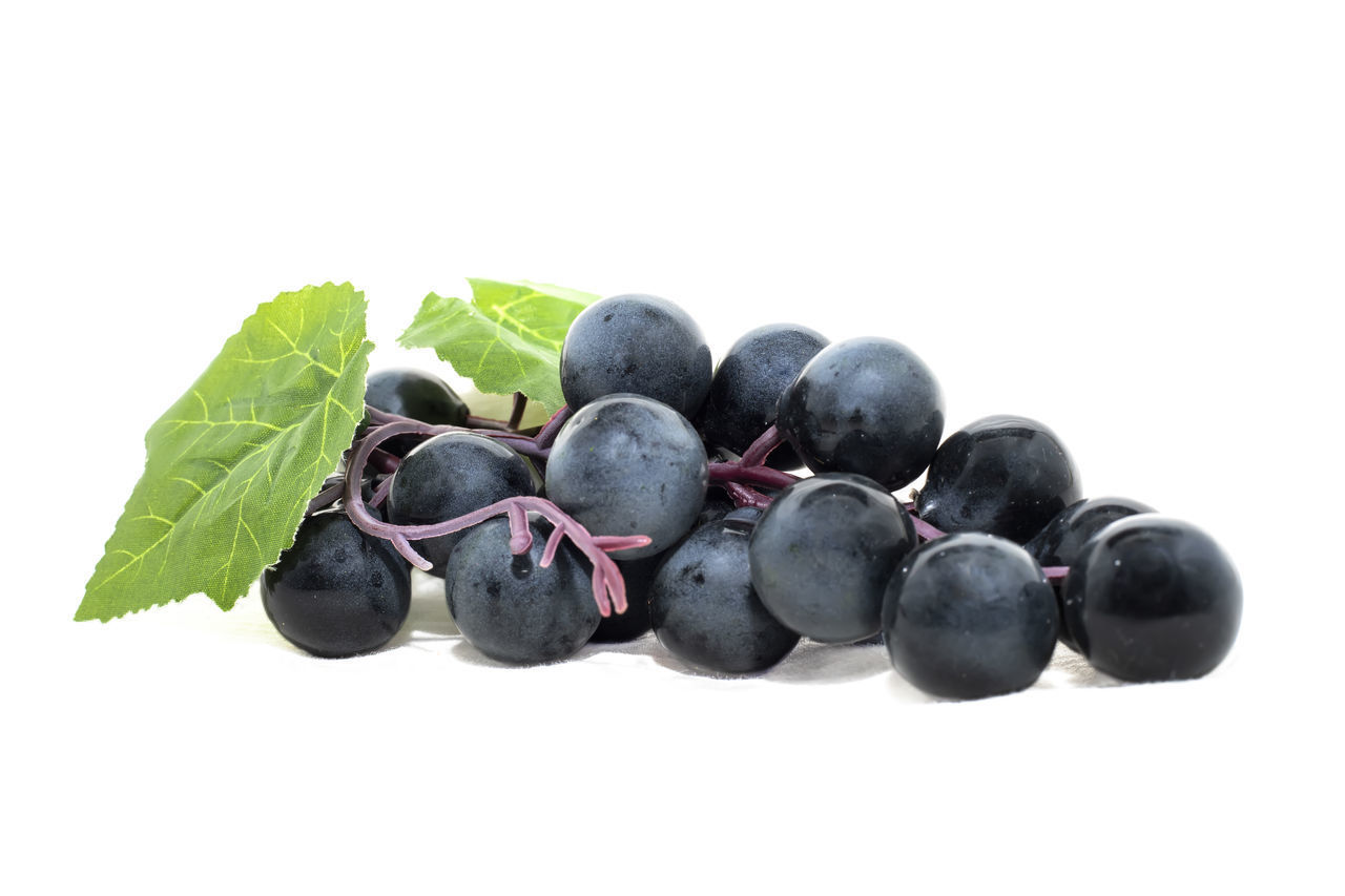 CLOSE-UP OF FRESH FRUITS ON WHITE BACKGROUND