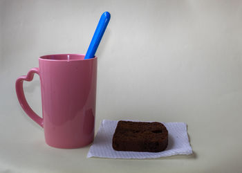 Close-up of coffee on table against white background