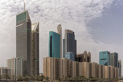 Skyscrapers in city against sky