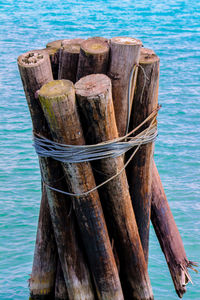 Close-up of wooden post in sea