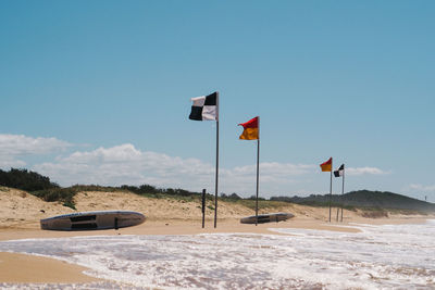 View of beach against blue sky