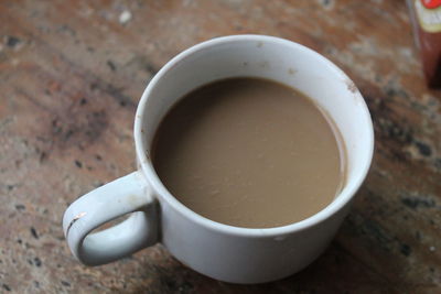 High angle view of coffee cup on table