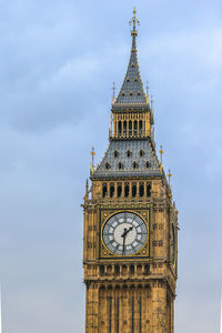 Low angle view of clock tower against sky