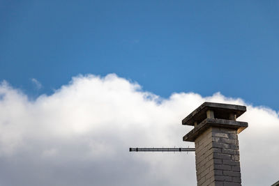 Low angle view of building against blue sky