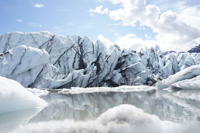 Scenic view of frozen lake against sky