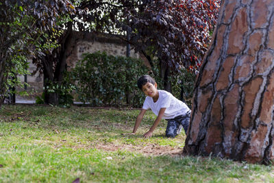 Young boy alone. having fun in a park.
