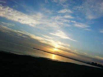 Scenic view of sea at sunset