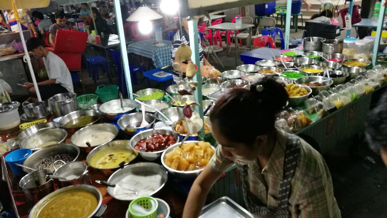 WOMAN HAVING FOOD IN KITCHEN