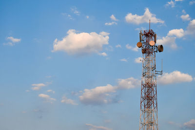 Low angle view of electricity pylon against sky