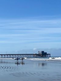 Scenic view of sea against blue sky