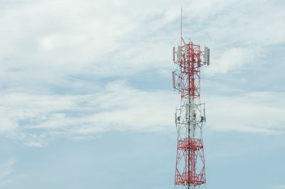 Low angle view of communications tower against sky