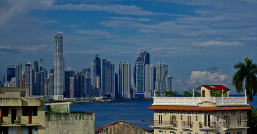 Buildings in city against sky