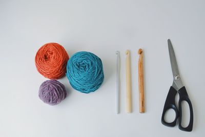 Close-up of colored pencils over white background