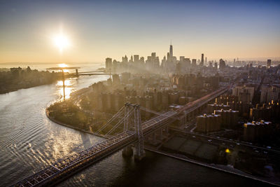 High angle view of bridge over river against buildings in city