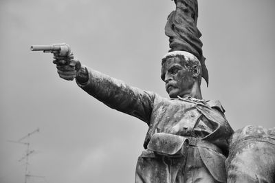 Low angle view of statue against sky