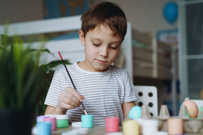 Boy playing with toy blocks