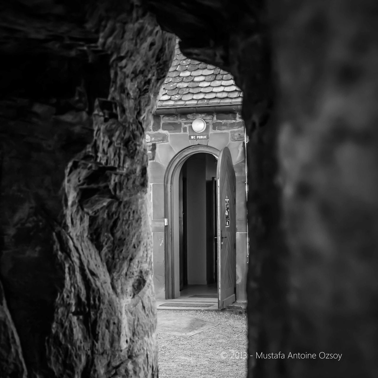 architecture, built structure, religion, spirituality, building exterior, arch, place of worship, entrance, church, door, old, night, low angle view, no people, outdoors, cross, doorway