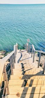 High angle view of pier over sea against sky