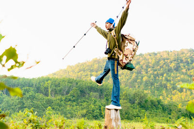 Low angle view of man standing on field