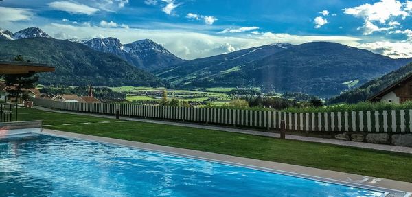 Scenic view of mountains against cloudy sky