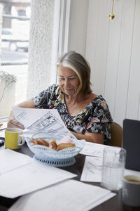 Senior woman doing paperwork