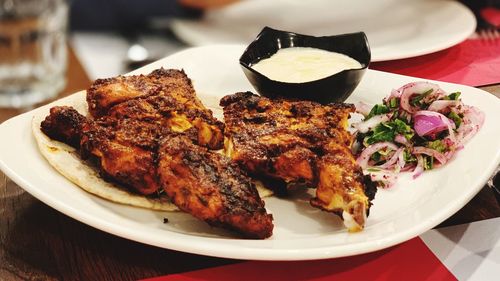 High angle view of meat in plate on table