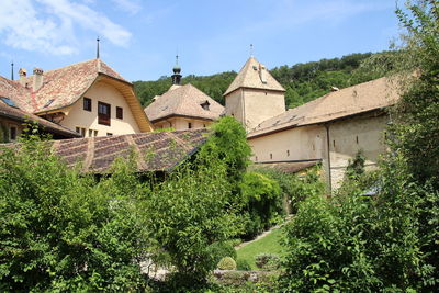 Panoramic view of houses and buildings against sky