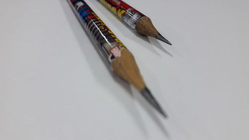 High angle view of pencils on white background