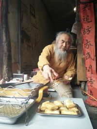 Mature man preparing food