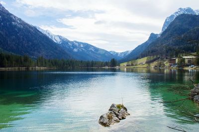 Scenic view of lake against cloudy sky