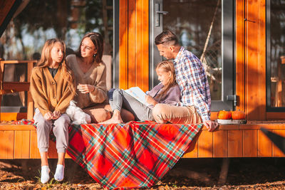 Group of people sitting outdoors