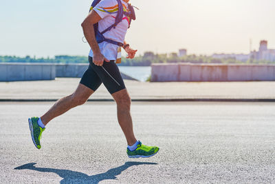 Full length of man running on road