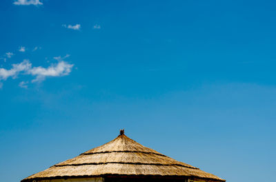 Low angle view of building against blue sky