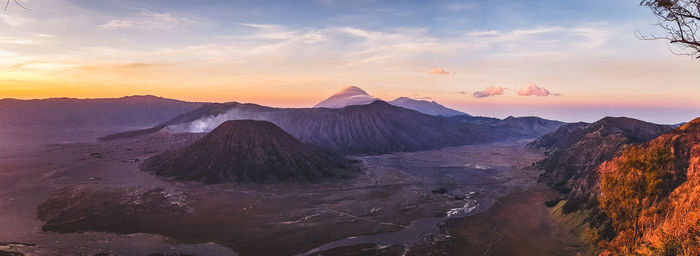 View of volcanic landscape against sky during sunset