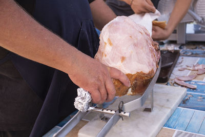 Midsection of man preparing food